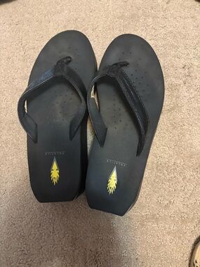 Ladies Volatile Black wedge Flip Flops with Yellow Flame Logo
